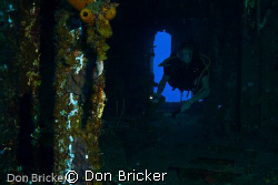 My son exploring the inside of the HMS Tibbet off the coa... by Don Bricker 